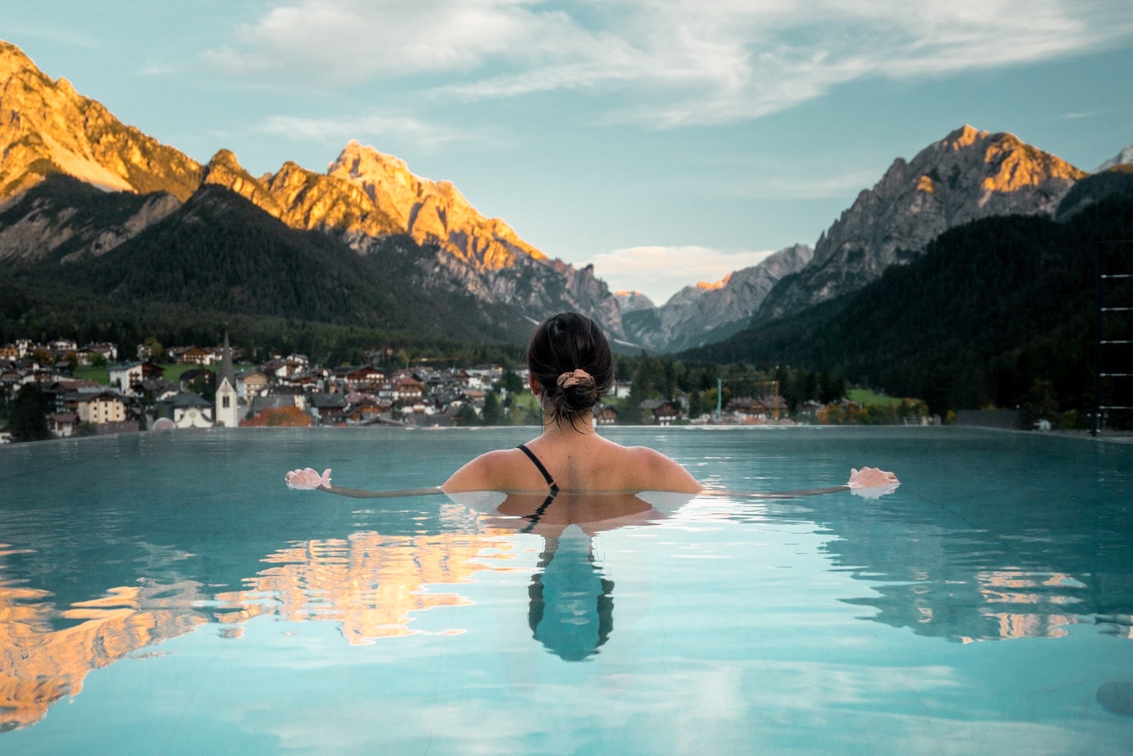 woman swimming in pool at Excelsior Dolomites