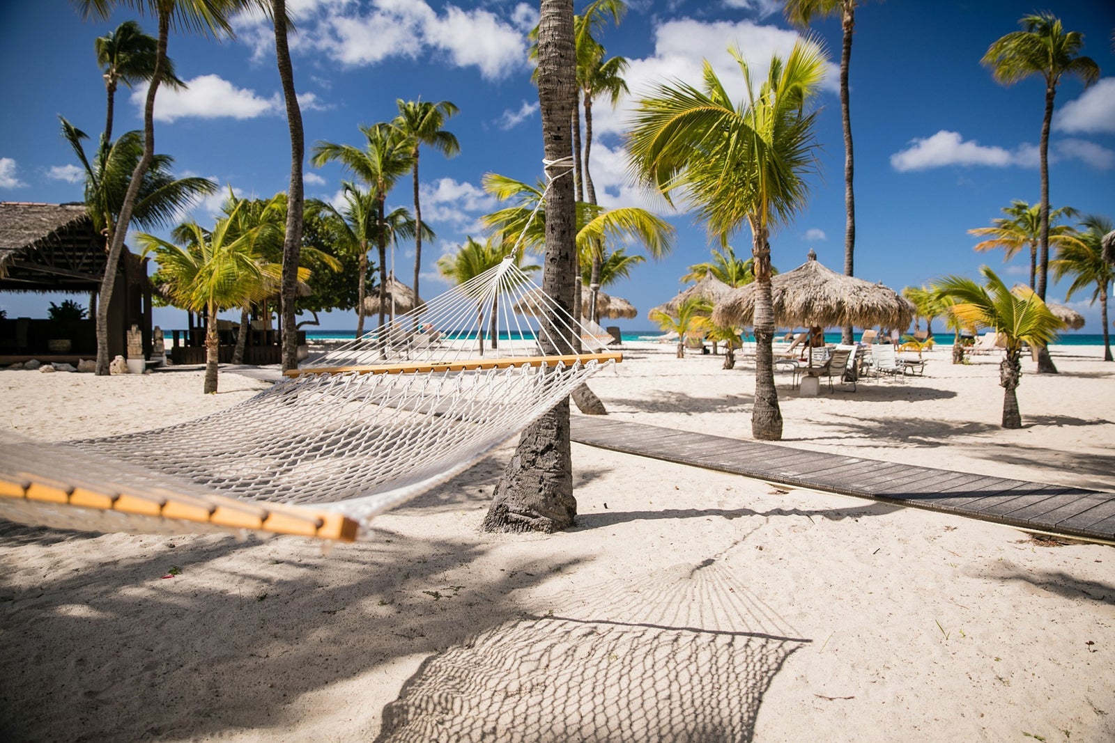 Hammocks on the beach at Manchebo Beach Resort and Spa