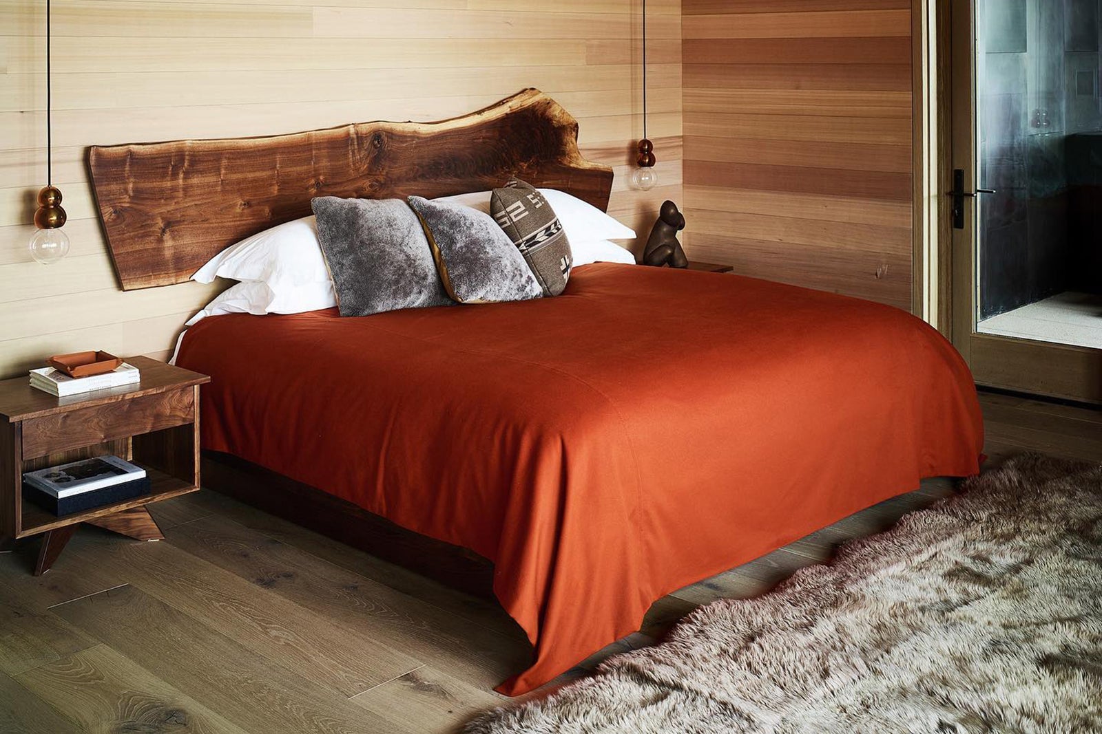 Guest room bed at Caldera House Jackson Hole