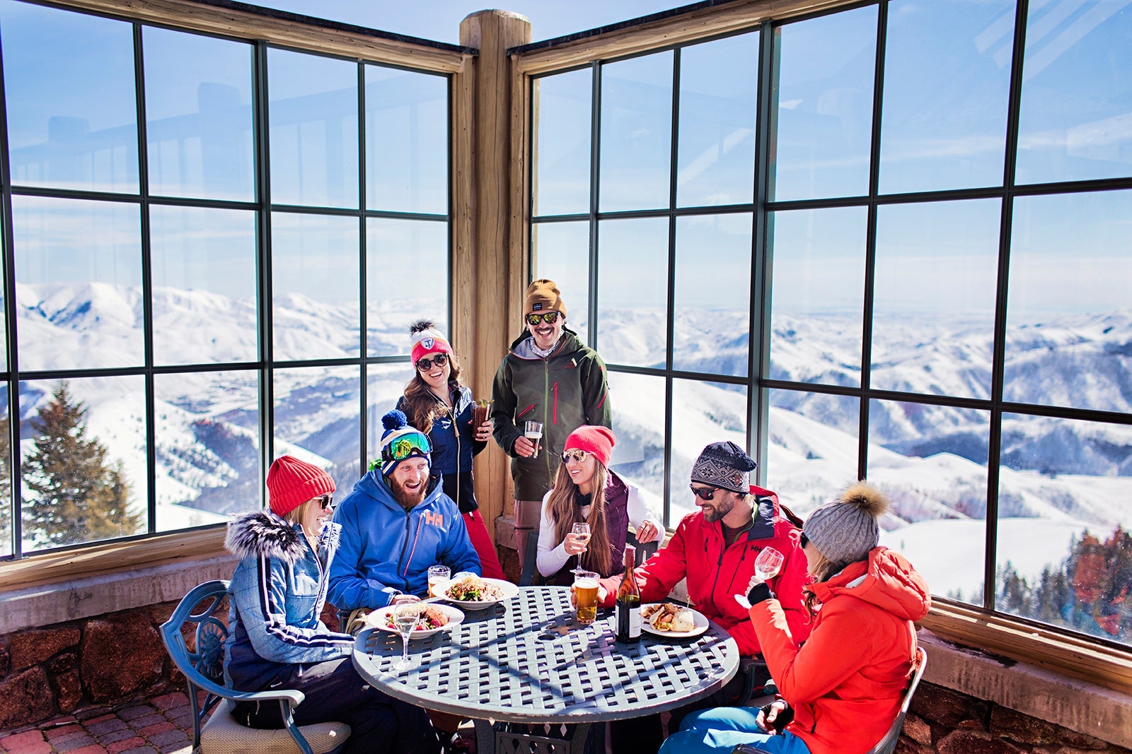 Group of skiers having a drink and overlooking the mountain at Sun Valley
