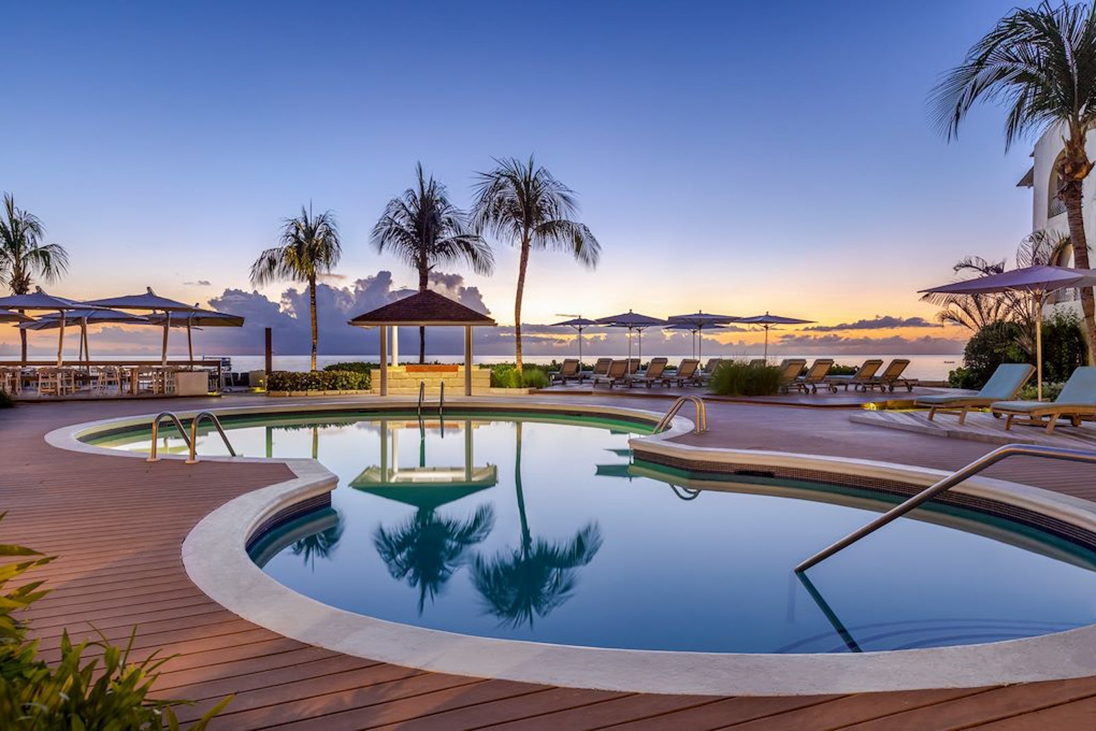 Pool at dusk at Tamarind by Elegant Hotels