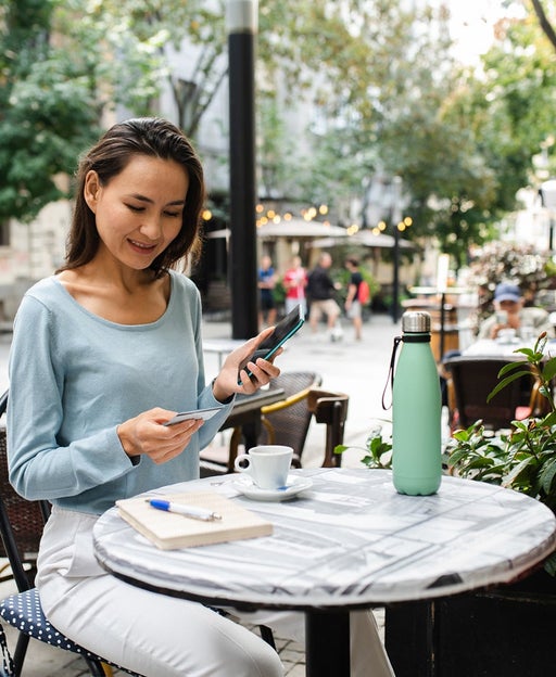 Woman sitting at an outdoor table