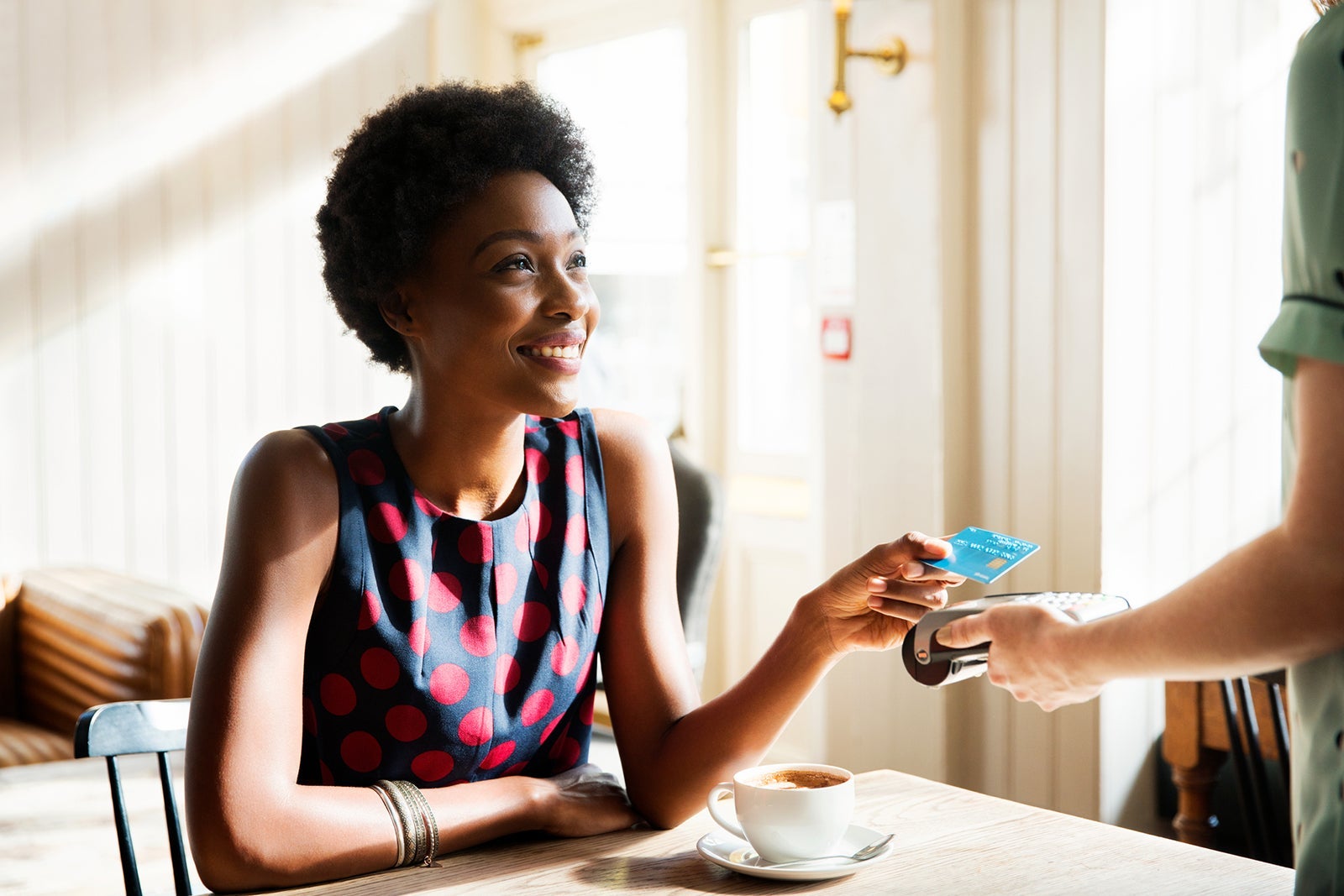 woman paying with credit card