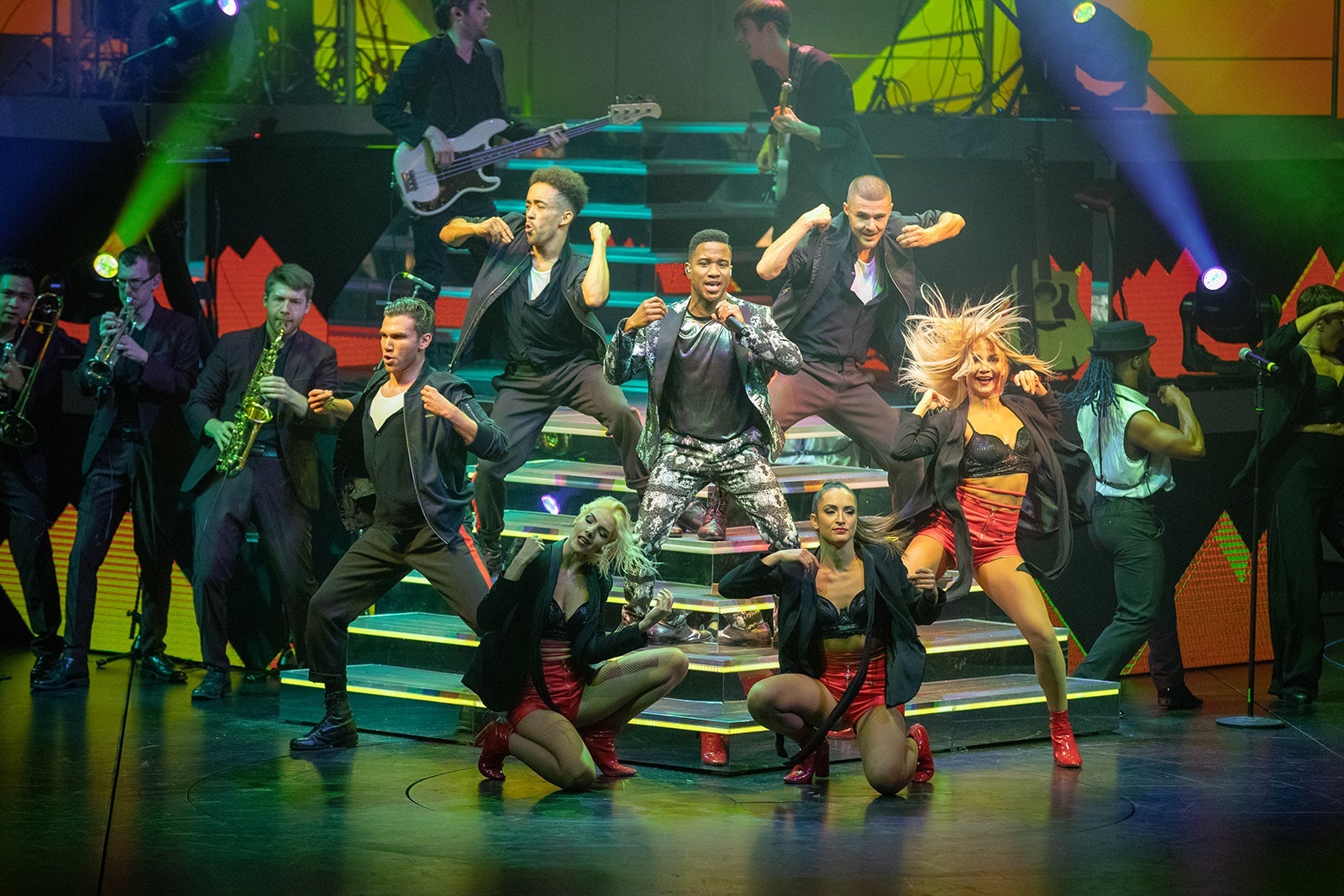 Dancers on a staircase in a cruise ship show