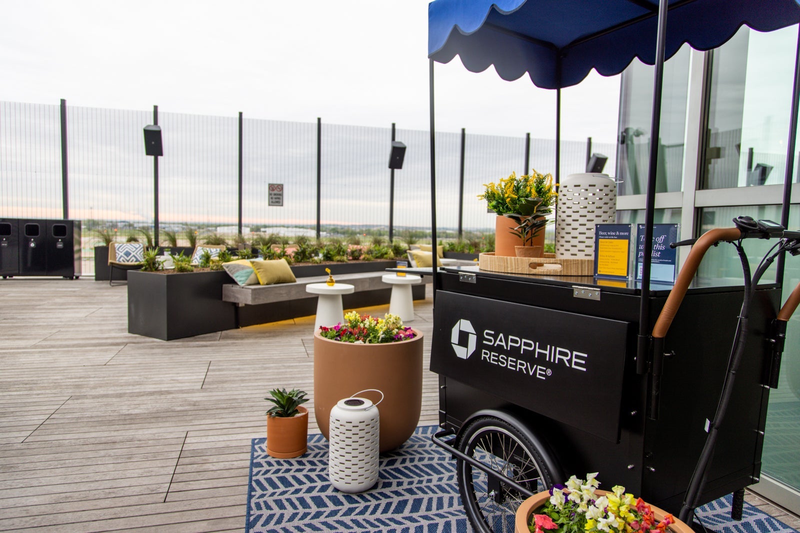 a drink cart with Chase Sapphire branding sits on an outdoor patio