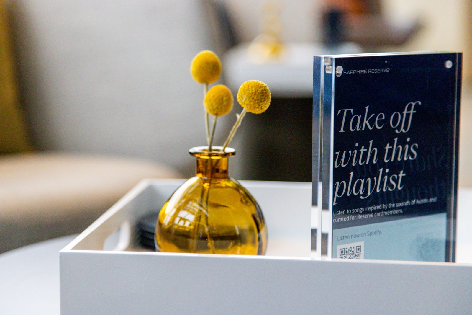 a sign offers a QR code to scan for a playlist of music