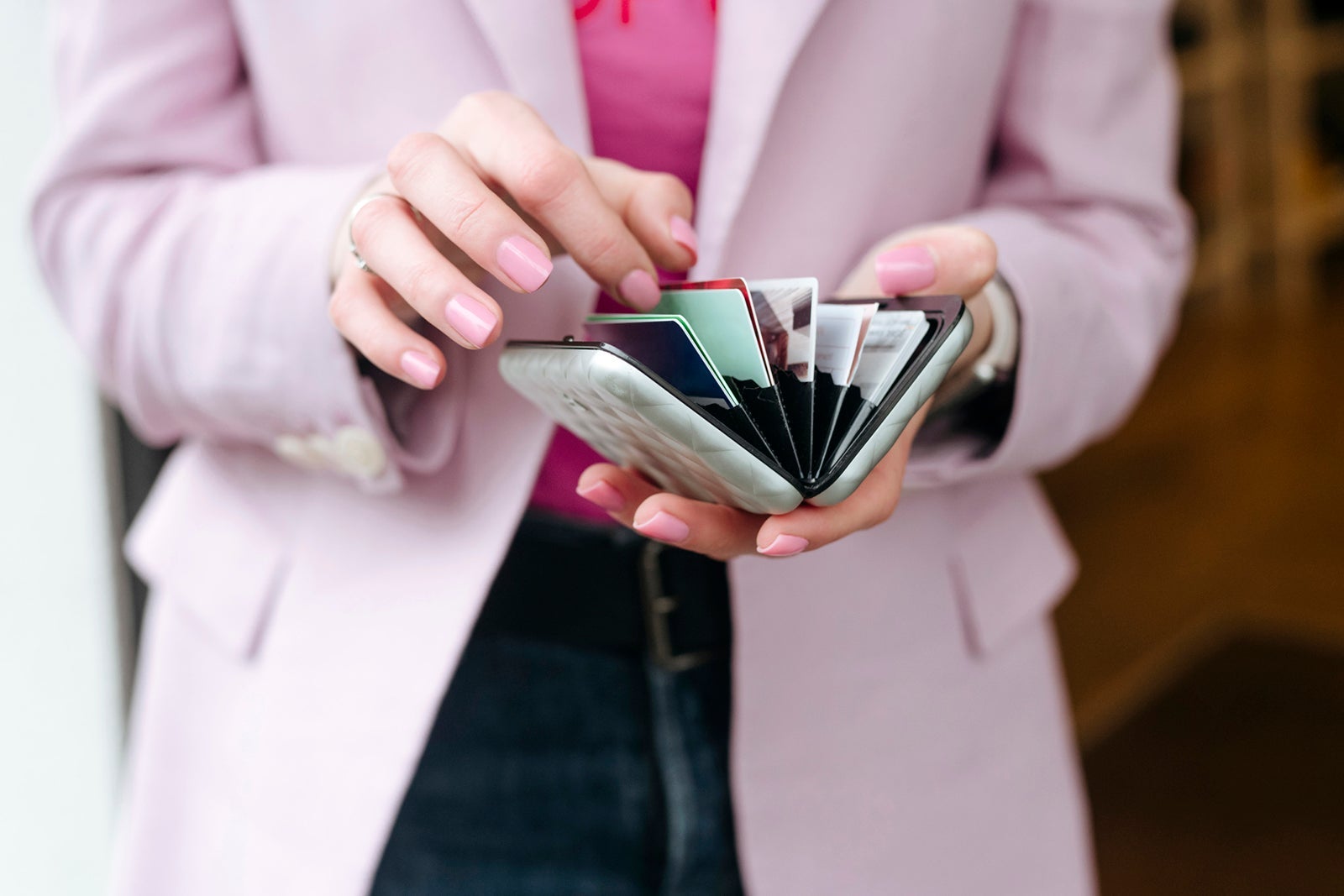Woman holding a card walllet