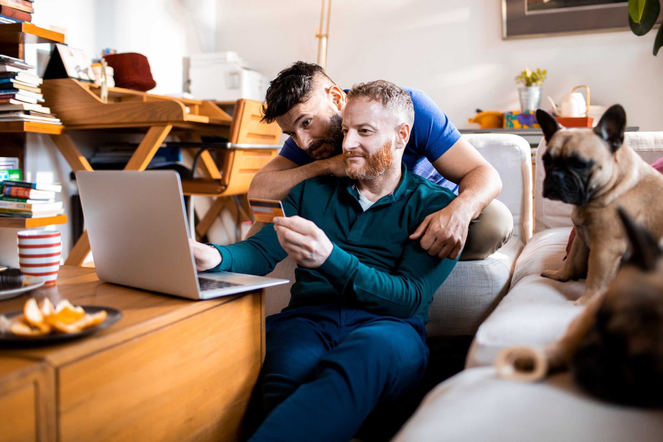 Men shopping online with a laptop