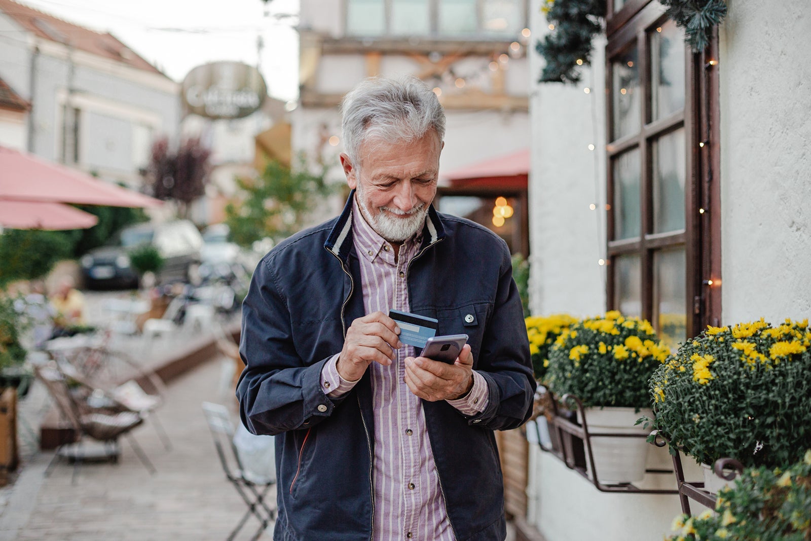 Man holding card in street