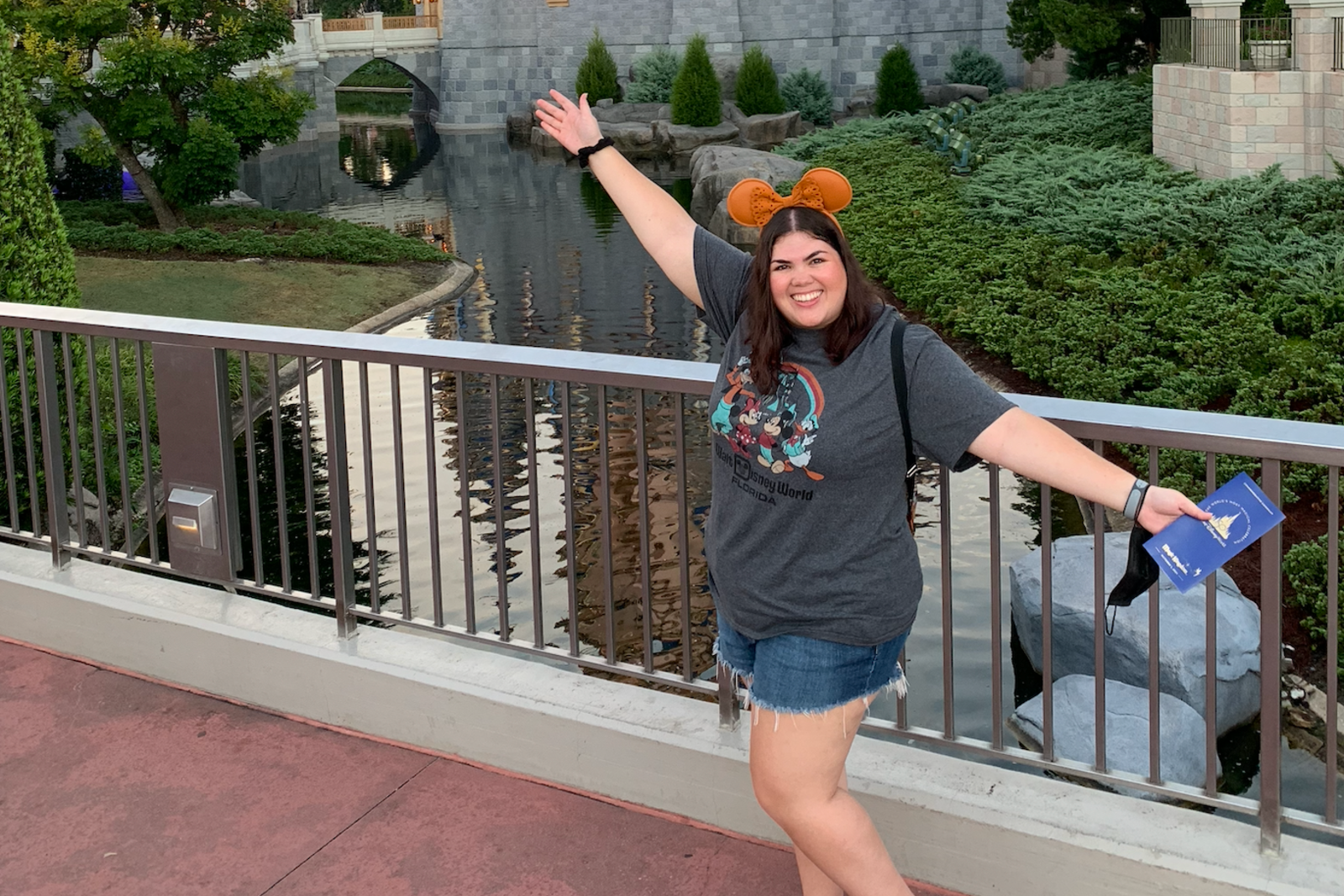 Madison standing in front of the castle at Magic Kingdom, Walt Disney World