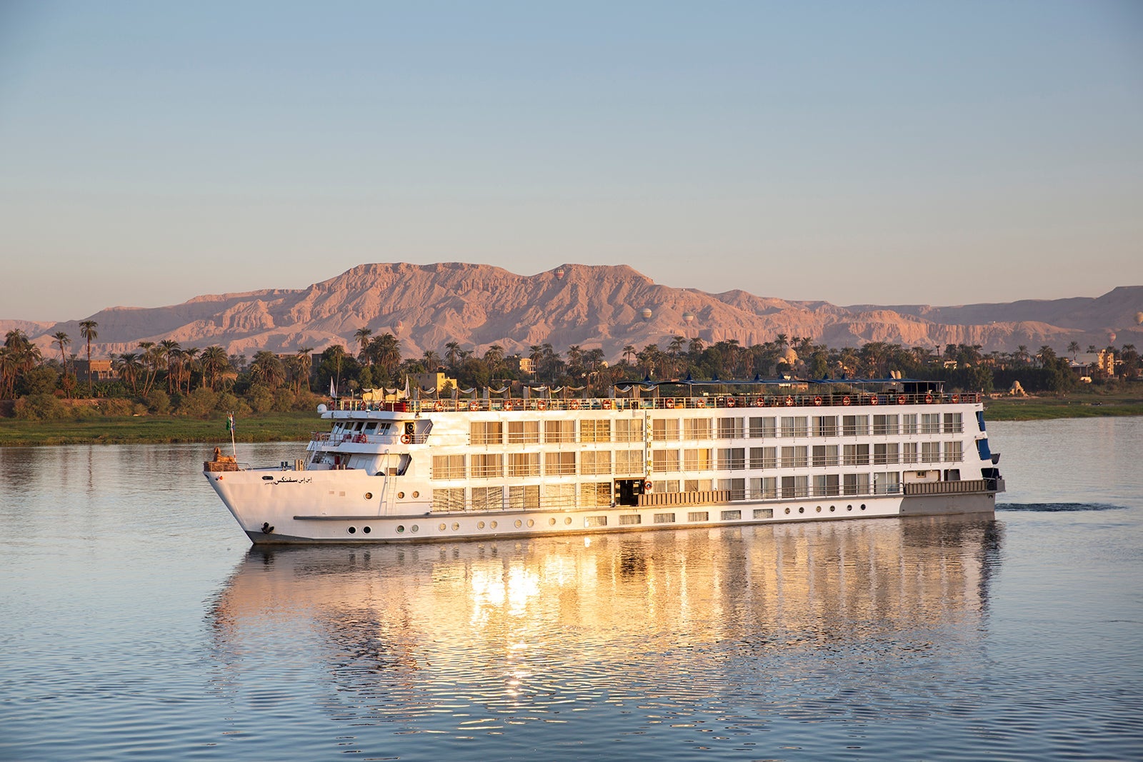 River cruise on Nile River with mountains in the background