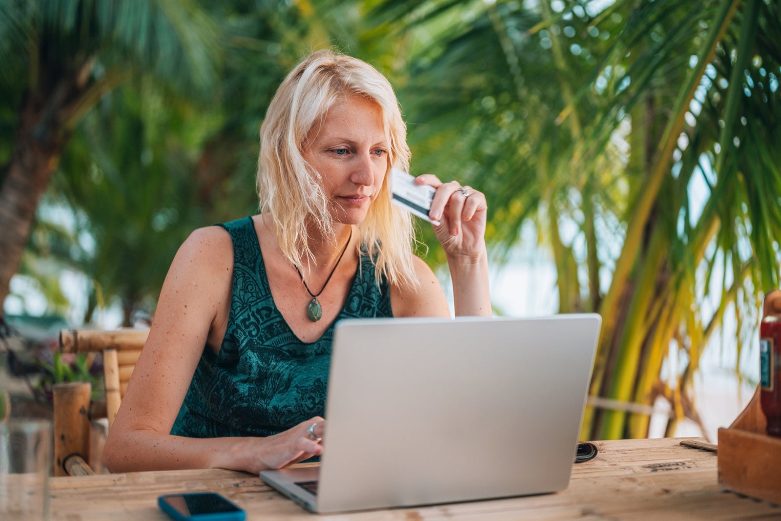 Woman purchasing a flight on her laptop