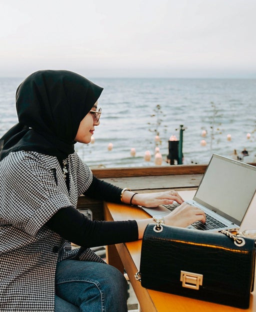 woman using her laptop outside