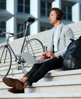 Man using a laptop outdoors