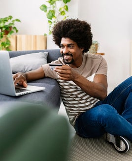 Man booking travel on his laptop