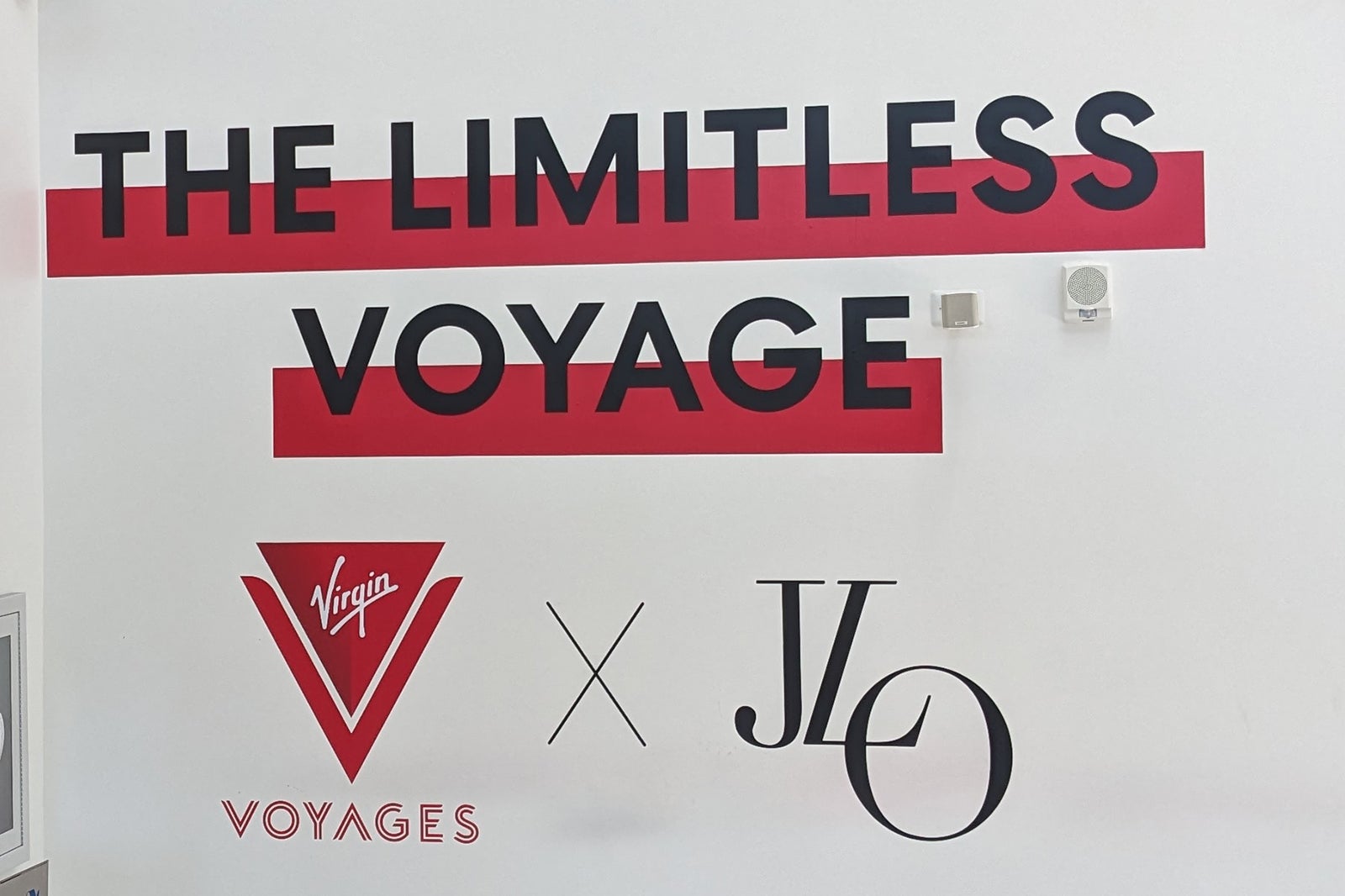 Sign reading "Limitless Voyage by Virgin Voyages and JLo"