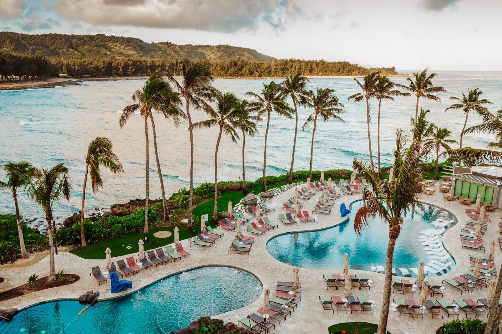 An aerial view of the pool and beach area of Turtle Bay Resort