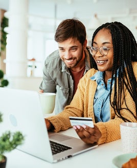 Couple using a credit card