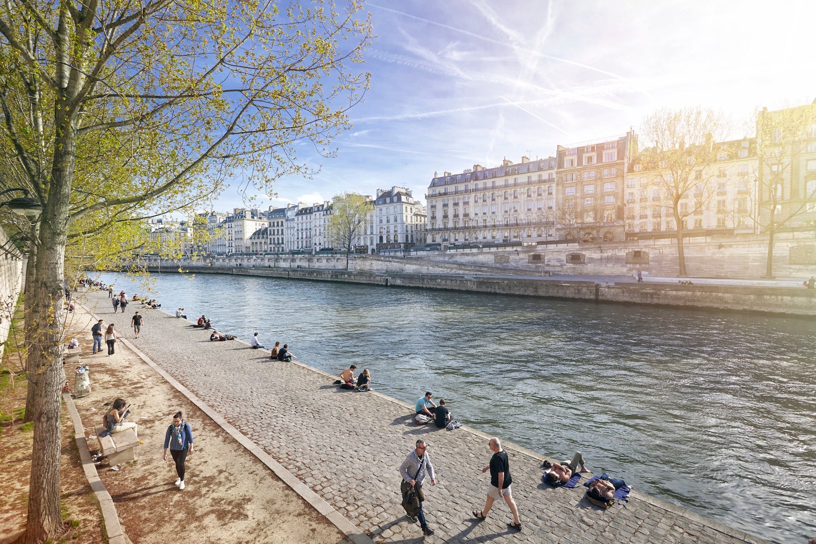 The River Seine walkway with Parisians relaxing, Paris, France