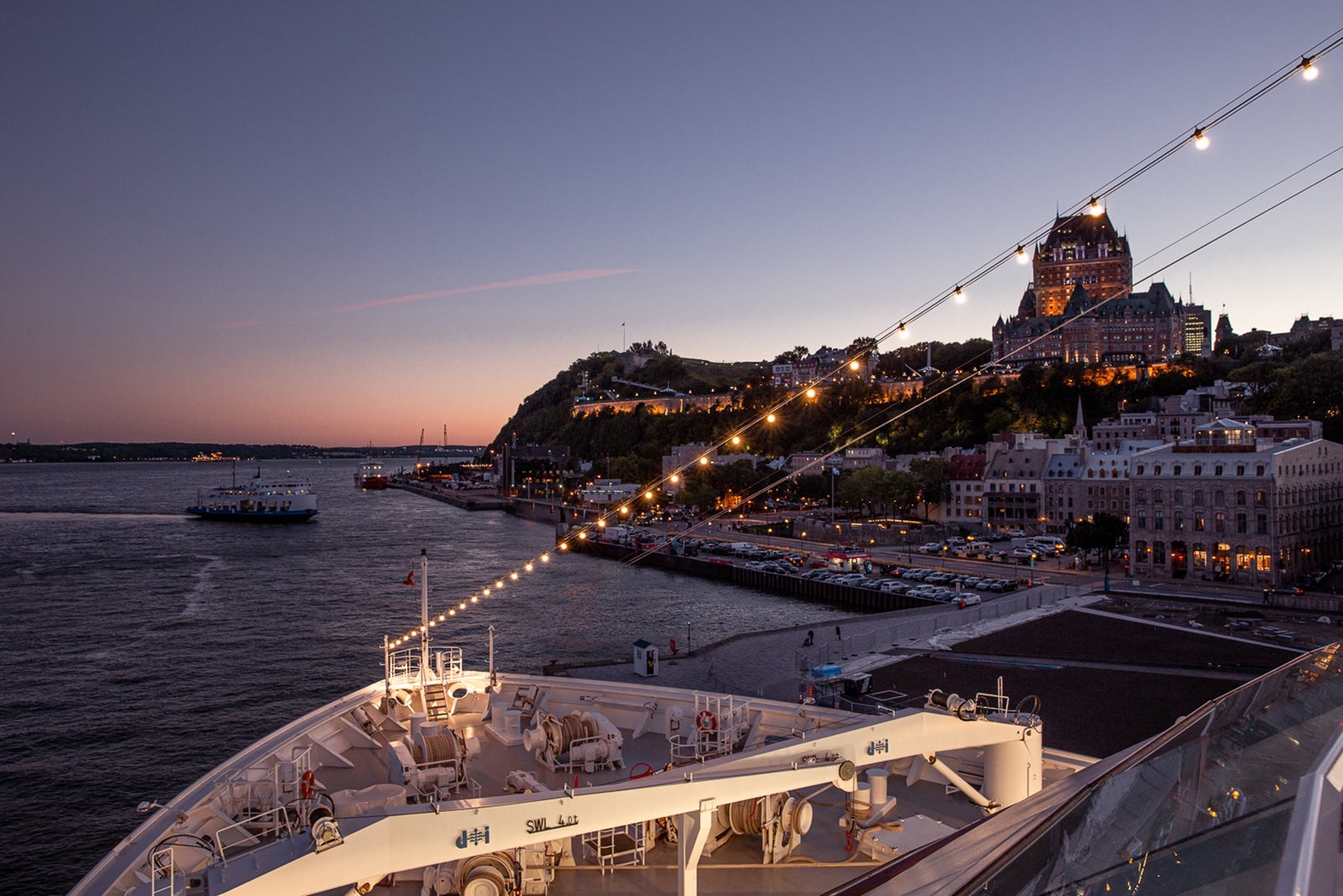 View from a cruise ship at night looking out over Quebec