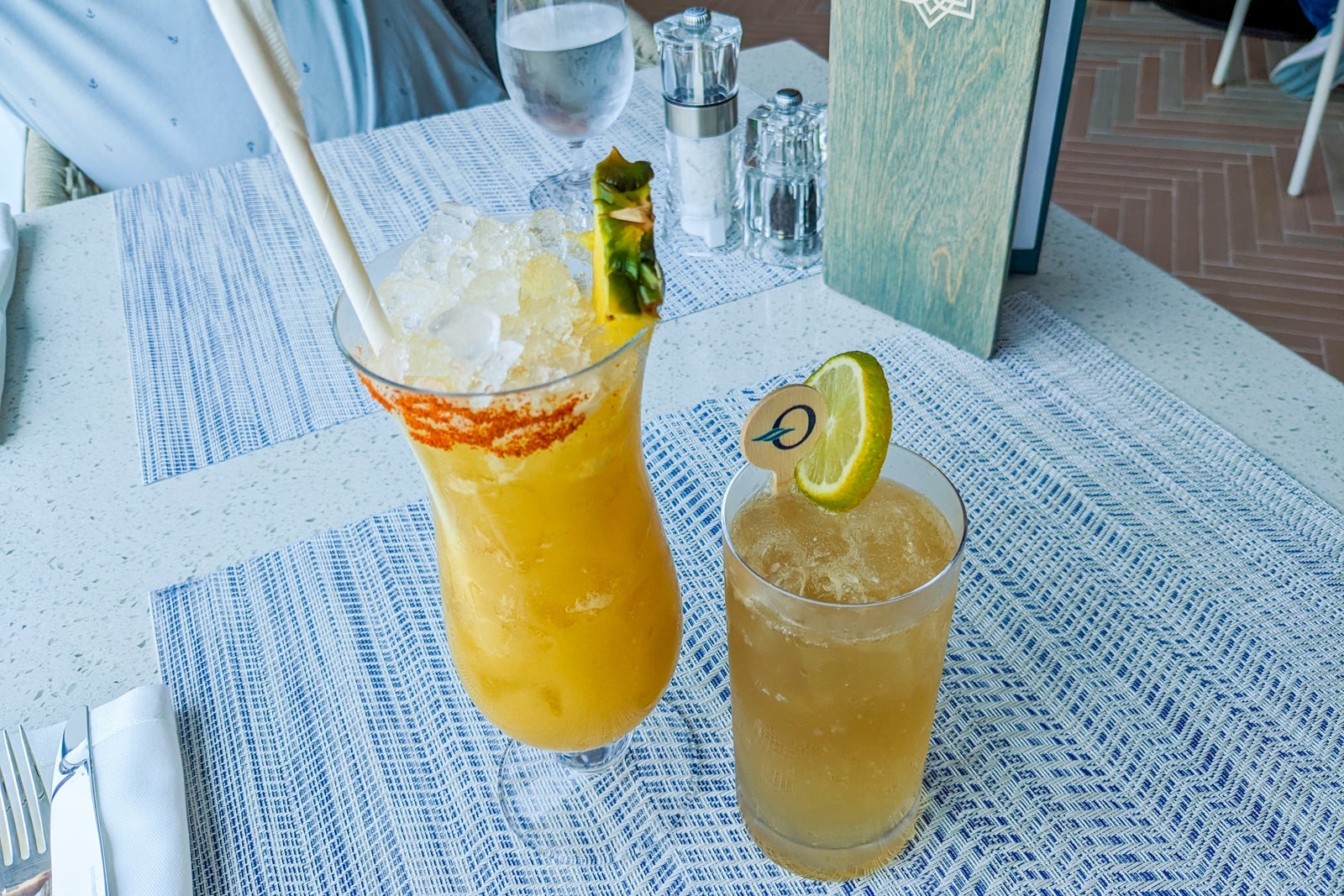 Two nonalcoholic cocktails on a restaurant table