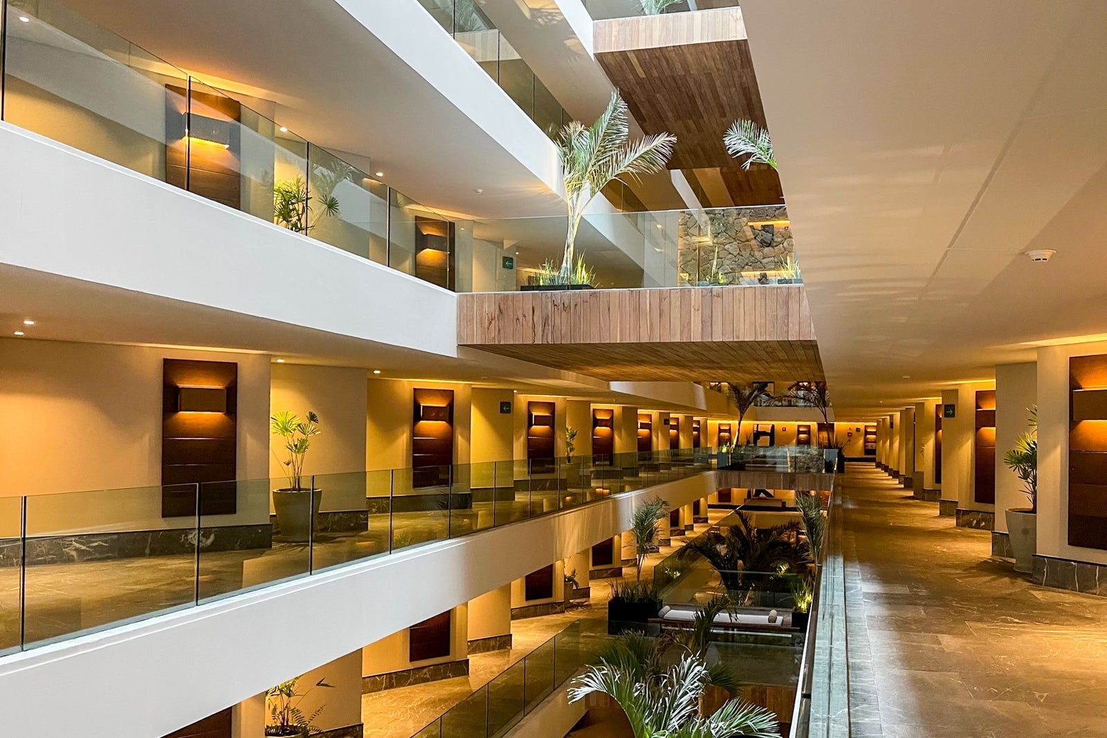 Interior hallway leading to guest rooms at Secrets Impression Moxche Playa del Carmen