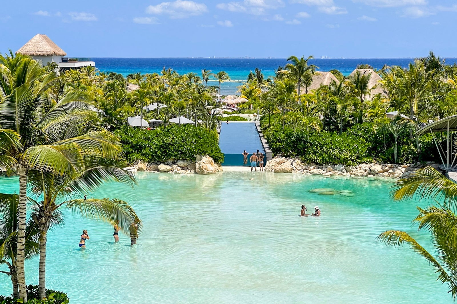 Infinity pool overlooking sand-bottom pool at Secrets Moxche Playa del Carmen