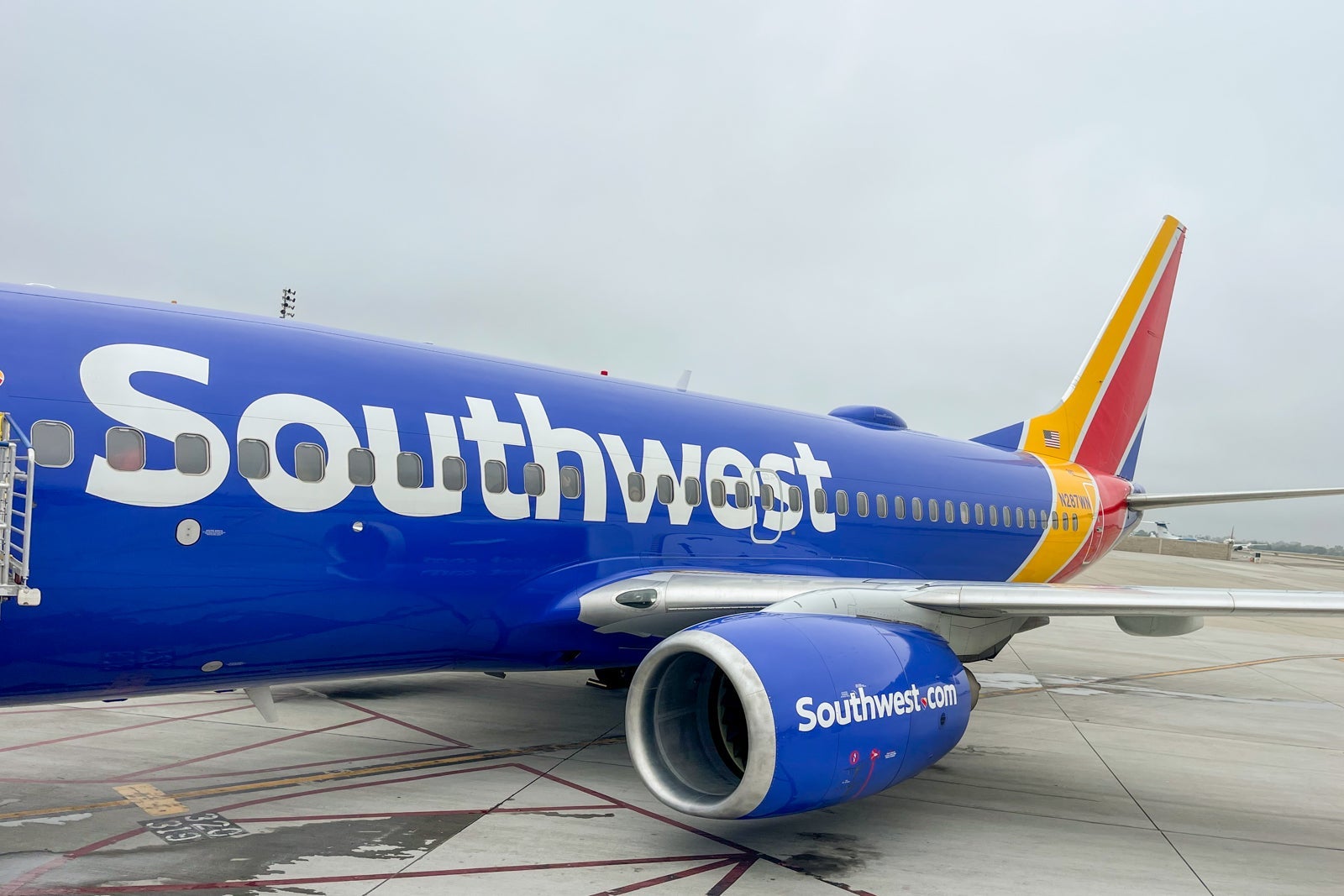 A Southwest Airlines plane parked at an airport on a cloudy day