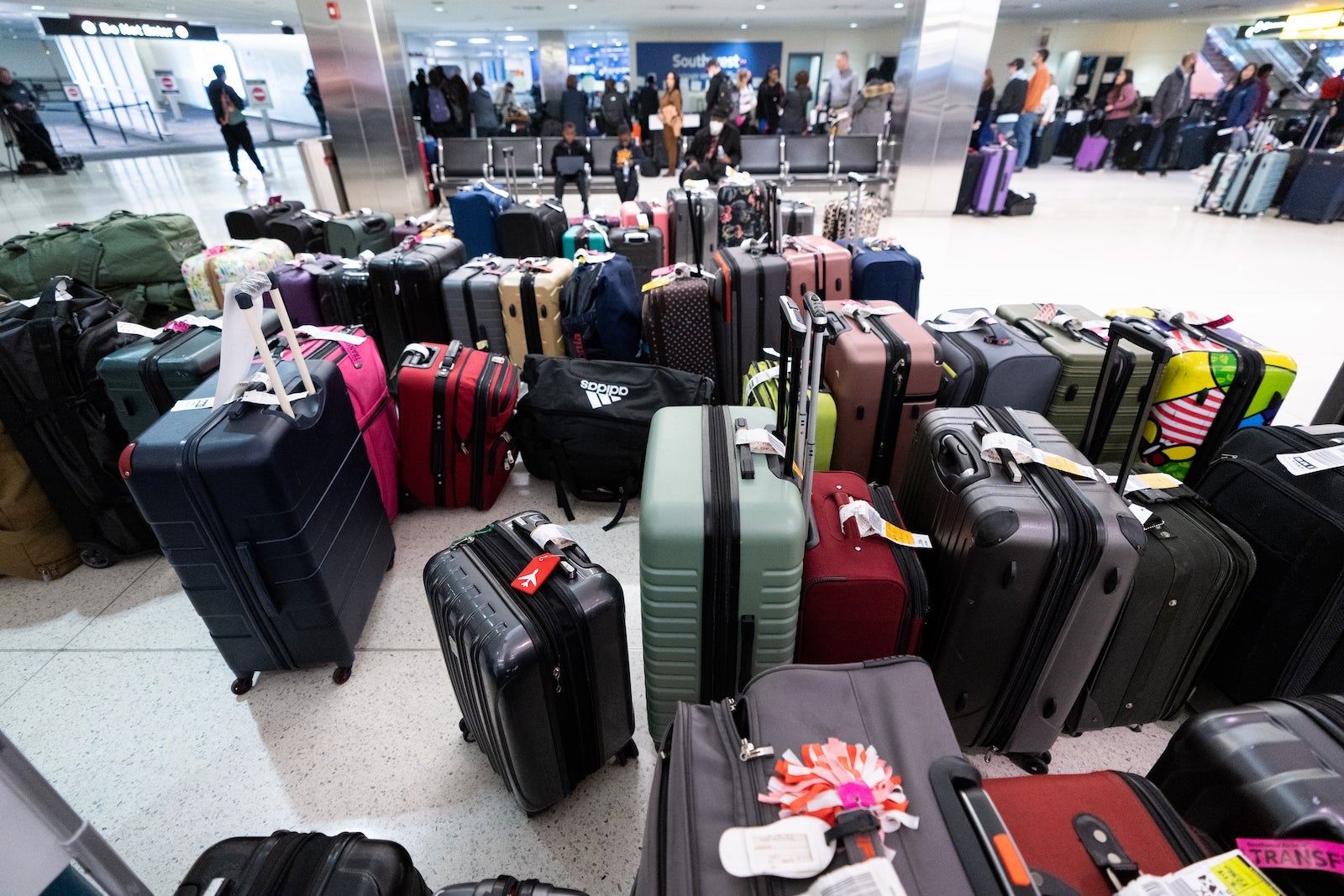 Suitcases at baggage claim at an airport