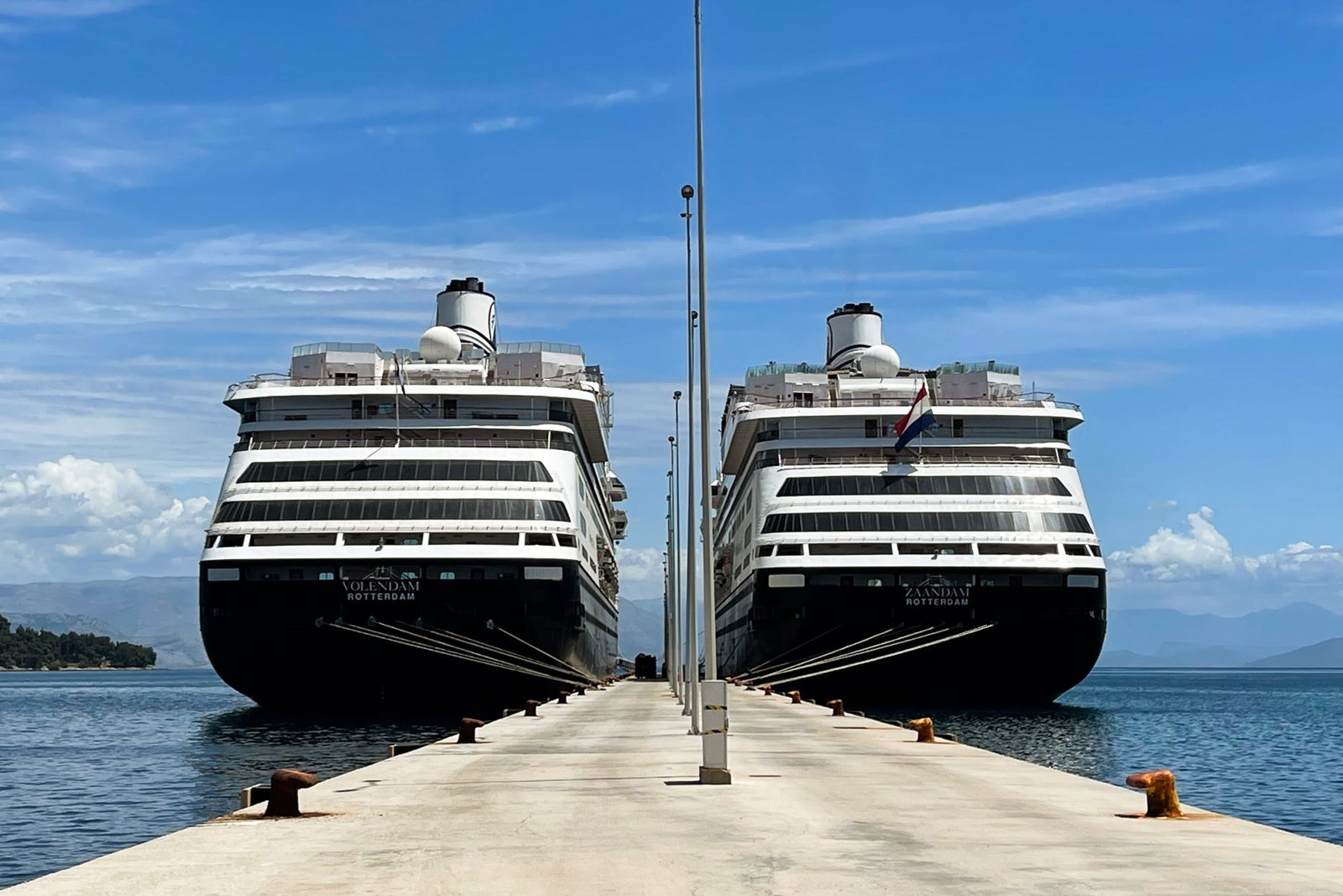 Two identical Holland America ships docked side by side