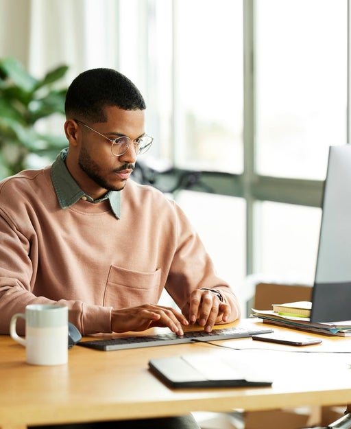 Man using a computer at home