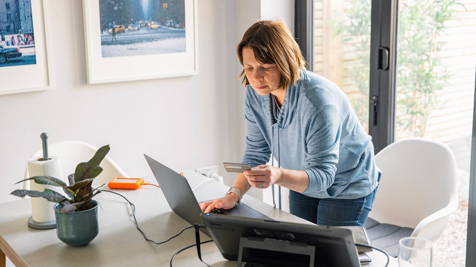 Woman making an online payment on her laptop using her credit card