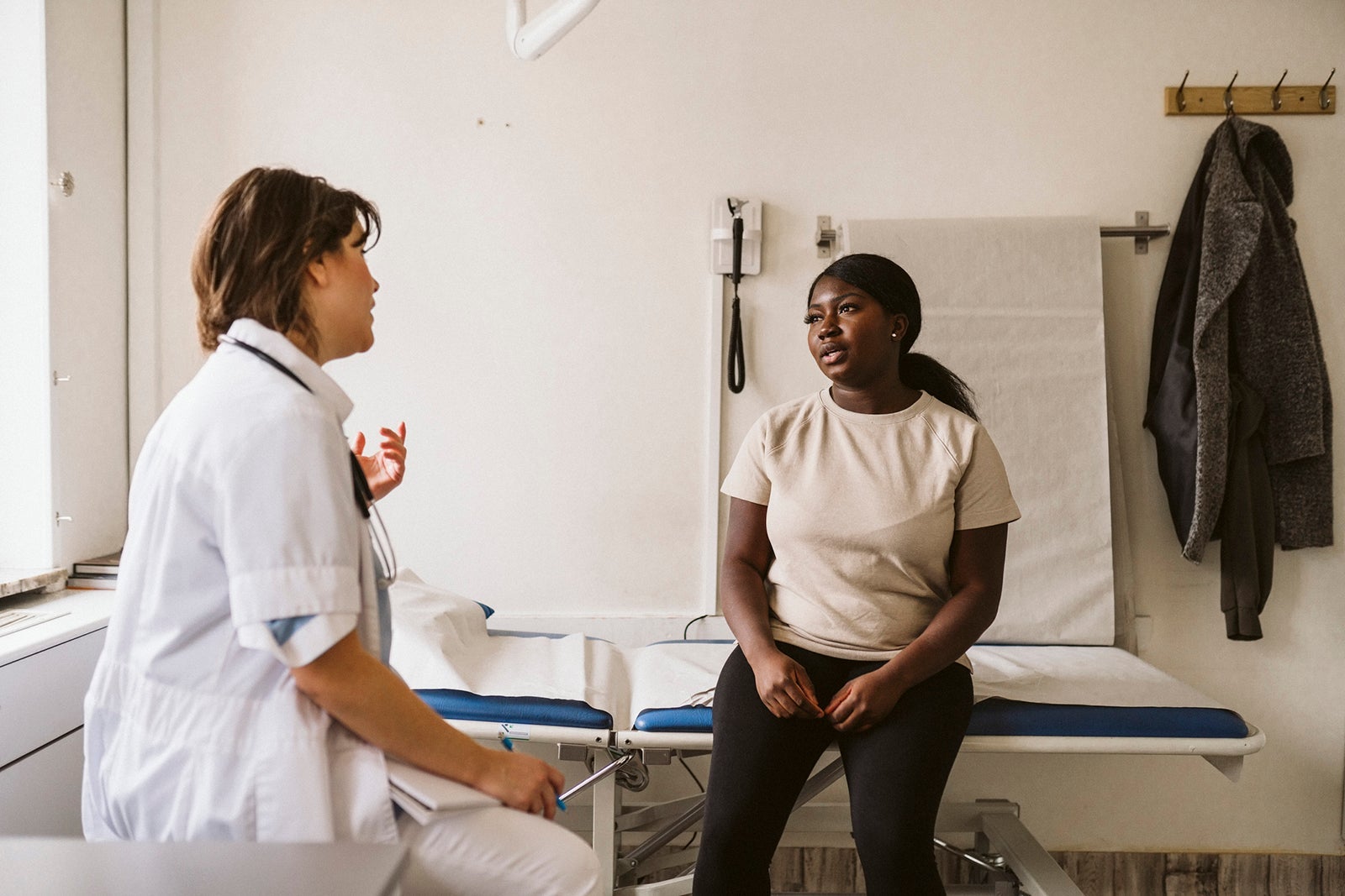 Woman speaking to a doctor