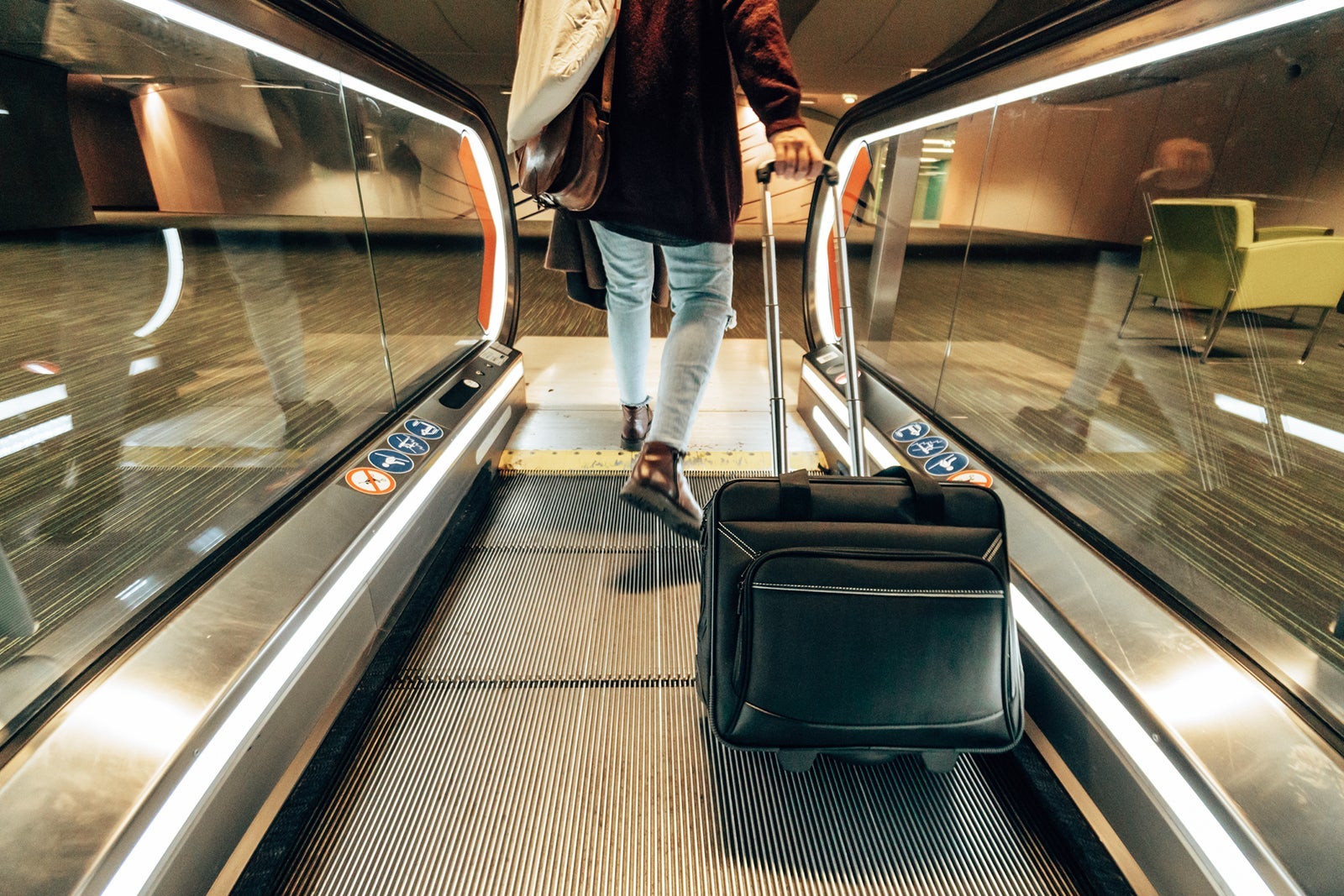 person with suitcase at airport