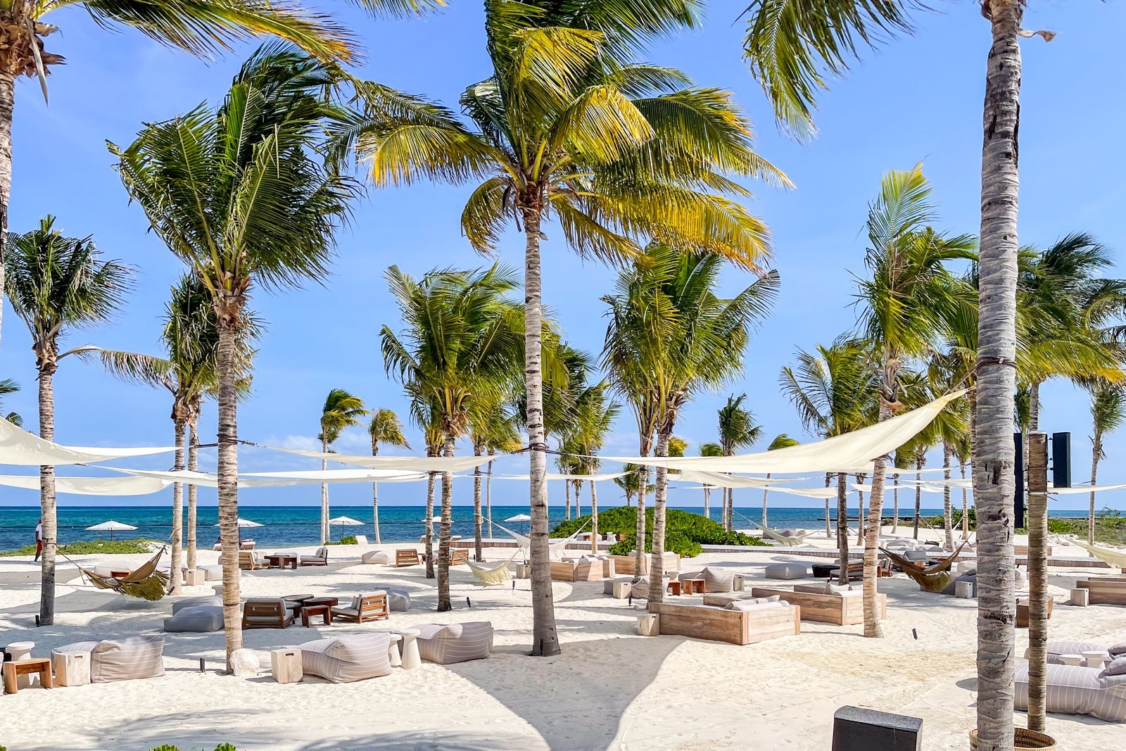 Shaded beach seating. St. Regis Kanai Resort, Riviera Maya