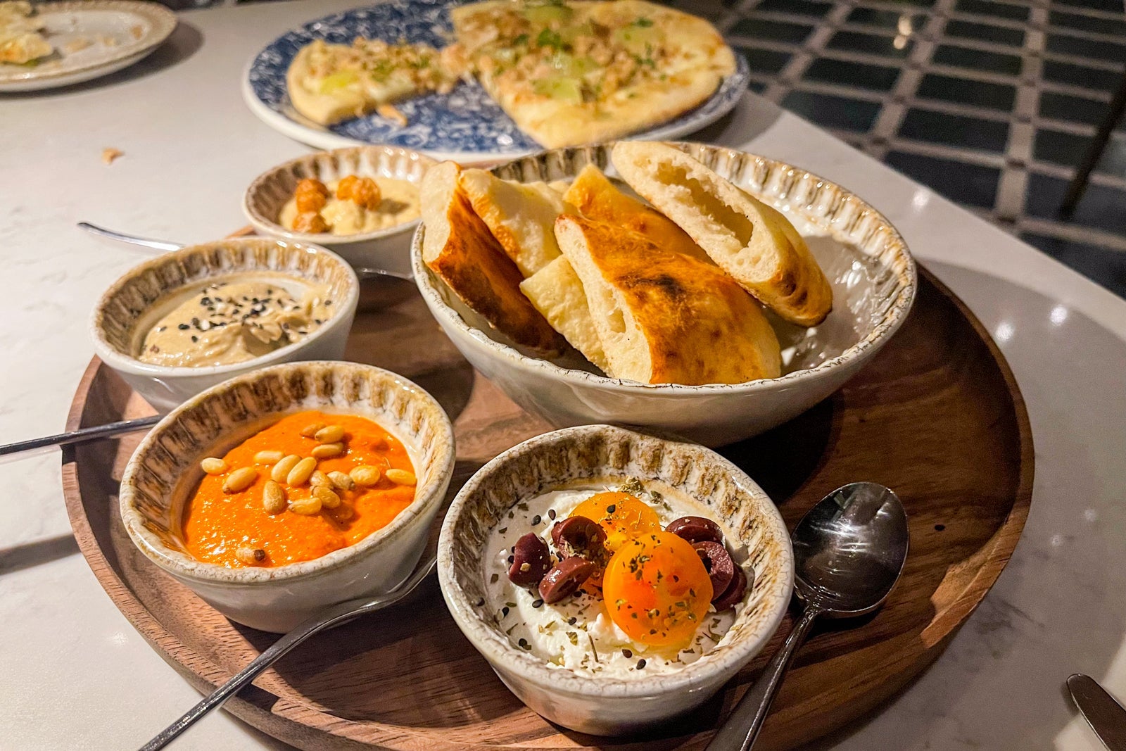 Mezeh platter and clam pizza. St. Regis Kanai Resort, Riviera Maya