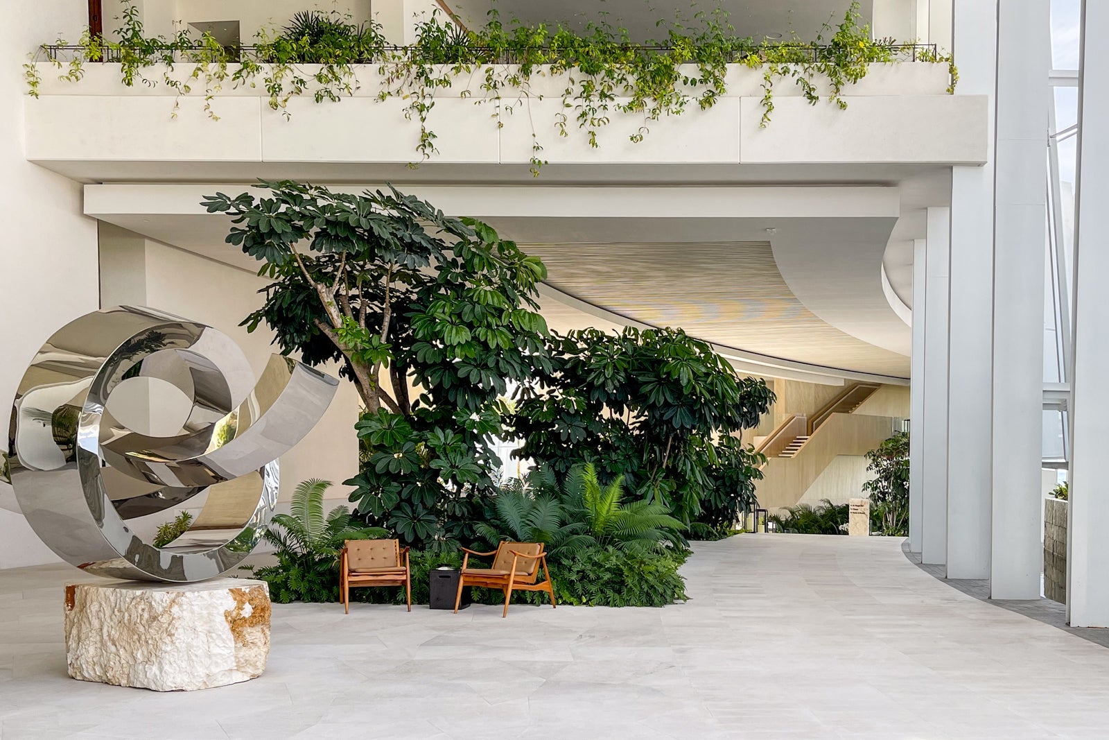 Sculpture and sweeping staircase. St. Regis Kanai Resort, Riviera Maya
