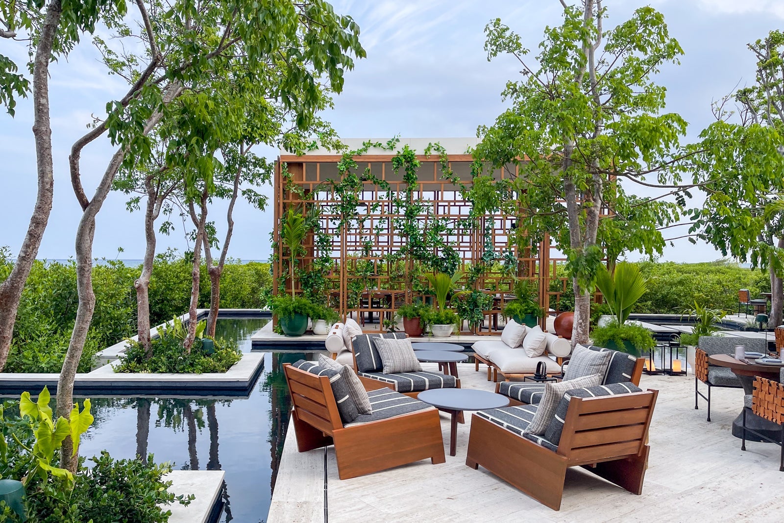 Toro outdoor seating and pergola. St. Regis Kanai Resort, Riviera Maya