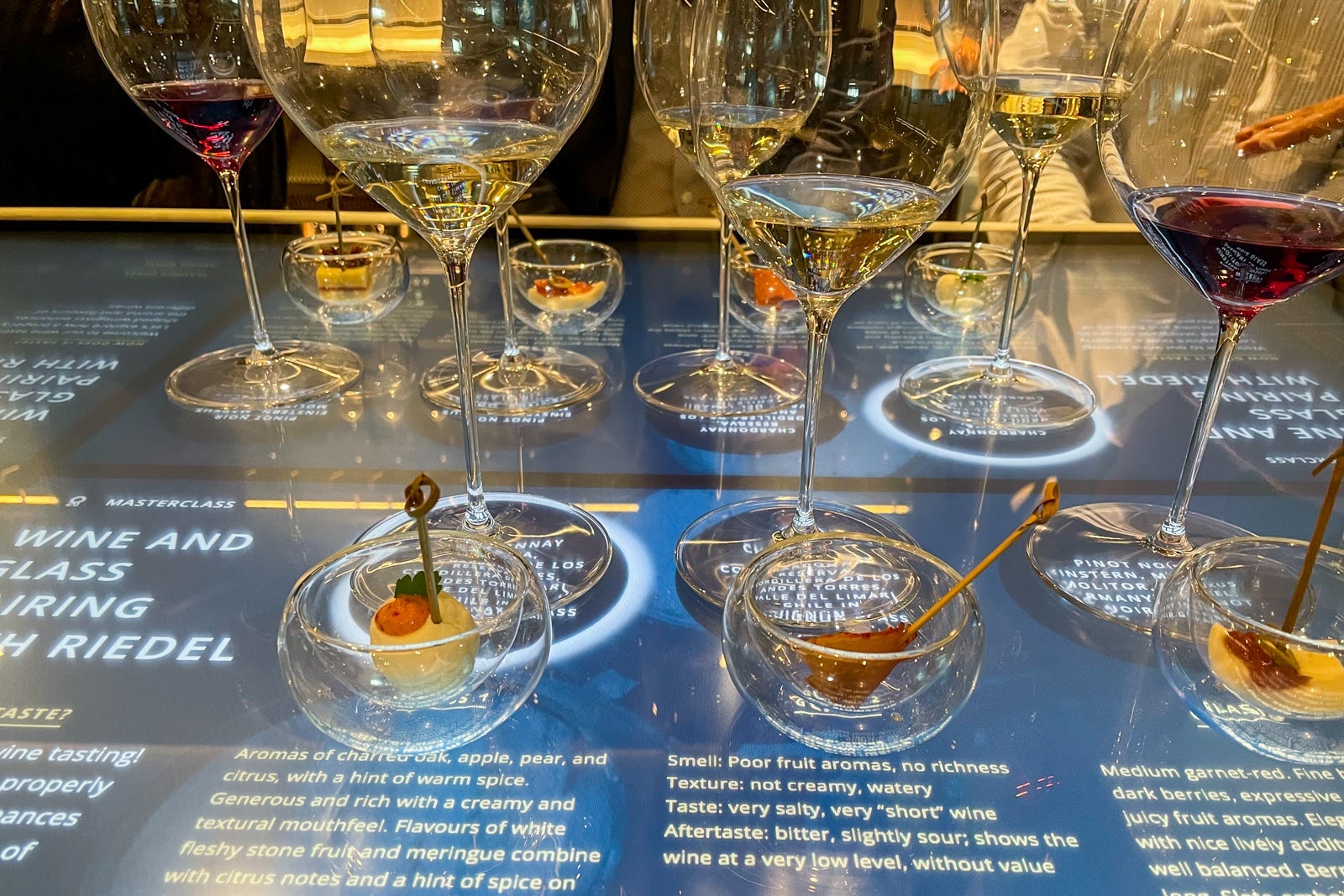 Wine glasses on touch-screen table.