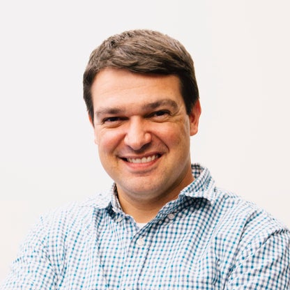 A headshot of TPG's Nick Ewen
