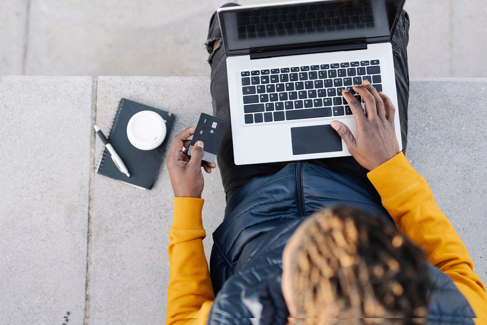 Top-down view of a person using a computer.