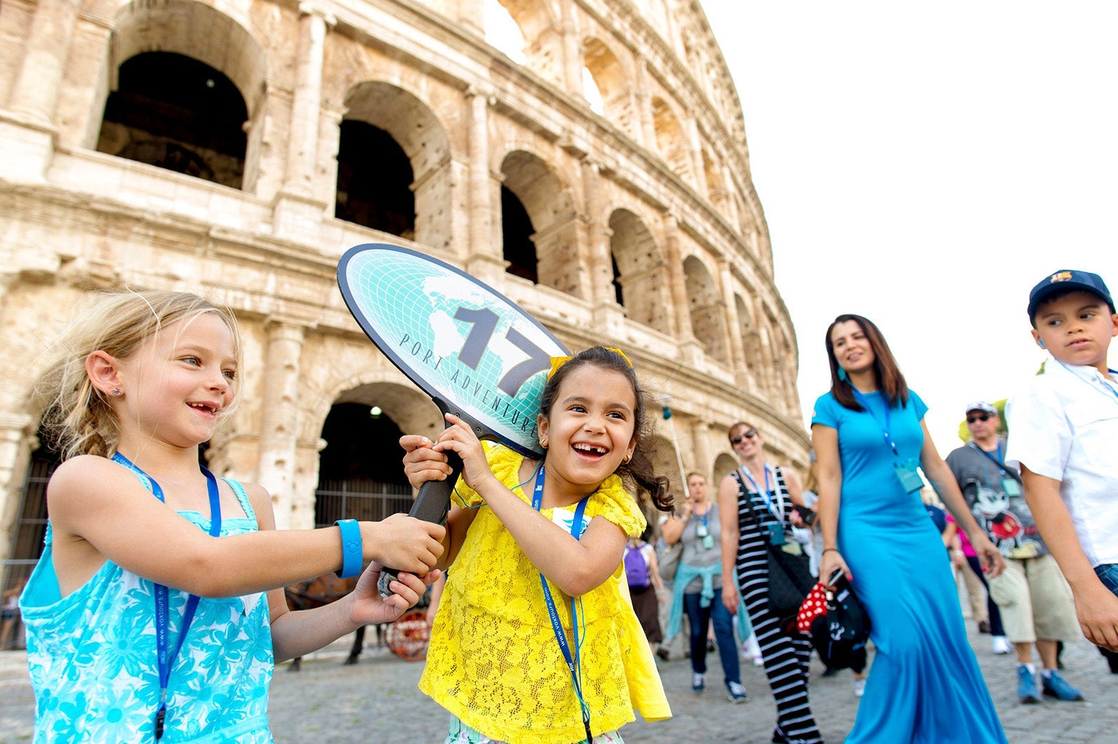 Kids on a Disney cruise ship tour outside of the Colosseum in Rome, Italy.
