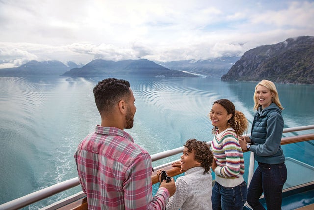 Multiracial family on a cruise ship in Glacier Bay, Alaska