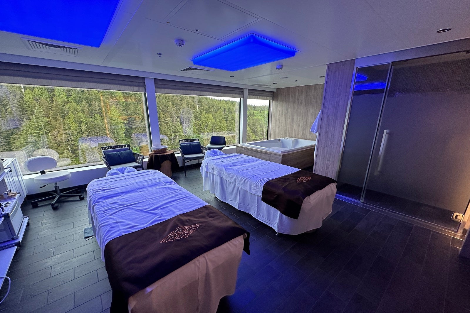 A couples massage room with two massage tables in a cruise ship spa