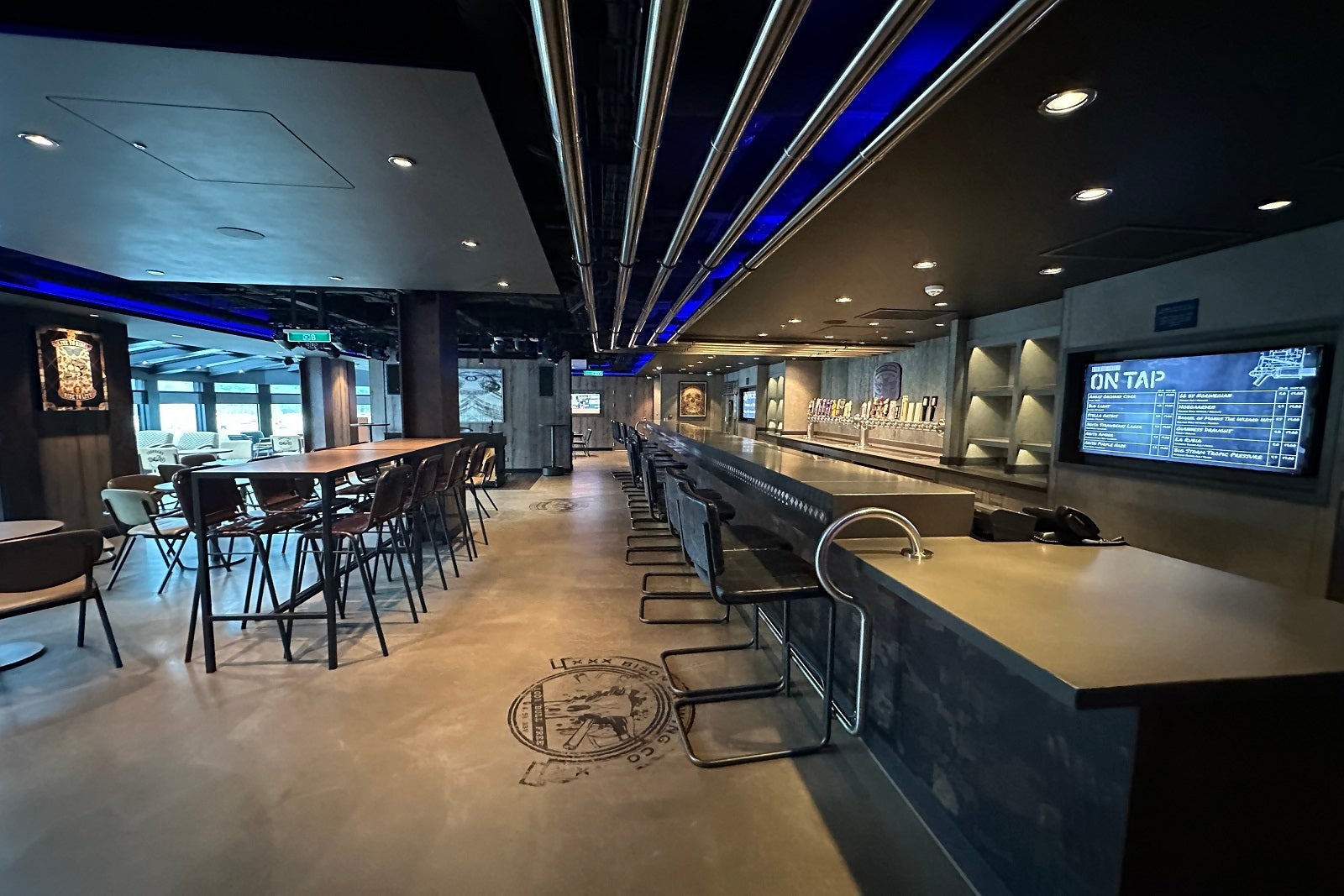 A cruise ship brewpub with bar and high-top seating