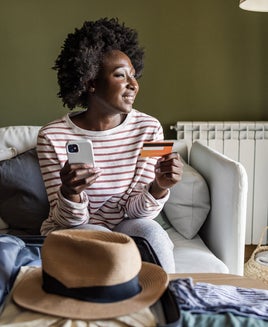 woman with card and phone