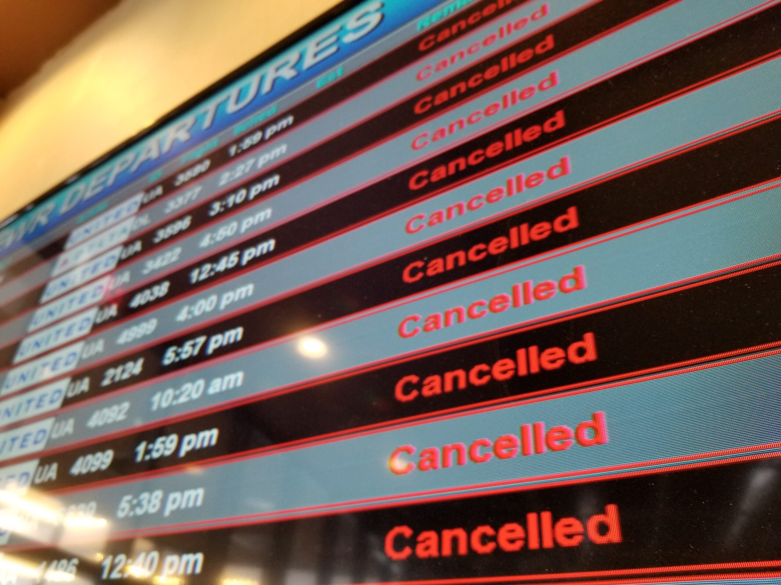Flight departures board showing all flights canceled 