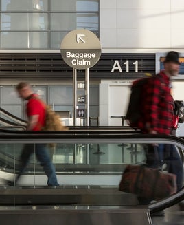 travelers walking through airport