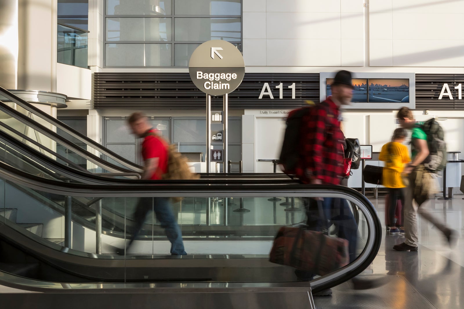 travelers walking through airport