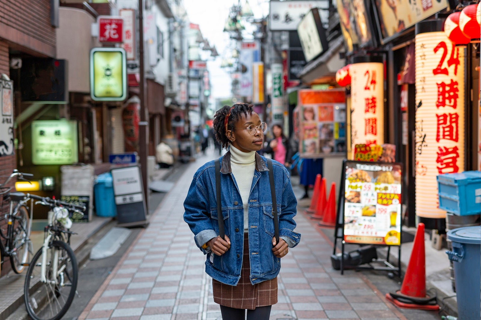 Tourist walks through streets of Japan